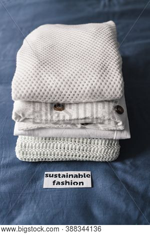 Fair Trade Concept, Pile Of Clothing With Sustainable Fashion Label