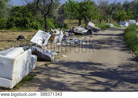 Big Problem Of Environmental Degradation. Plastic Waste, Non-functioning Appliances And All Kinds Of