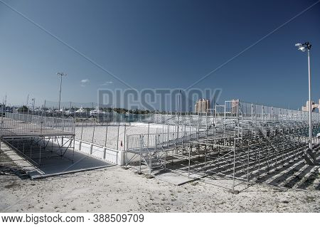 Empty Small Local Stadium Or Arena With Ground And Training Construction Near Tribunes Sunny Day Out