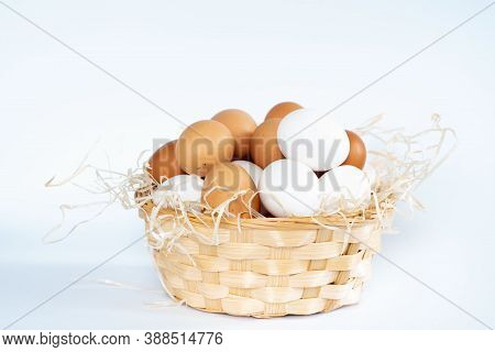 Close-up View Of Raw Chicken Eggs In Egg Box On White, Beige, Isolated Background. Mix White And Bro