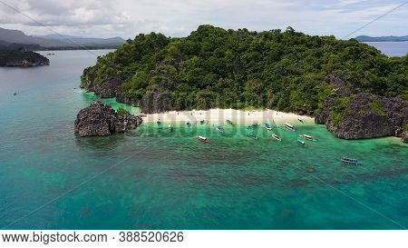 Tropical Landscape: Lahos Island With Beautiful Beach And Tourists By Turquoise Water View From Abov