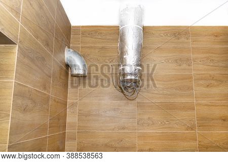 Modern Gas Boiler Room With Brown Ceramic Tiles Imitating Wood, Visible Air Inlet And Outlet, Prepar