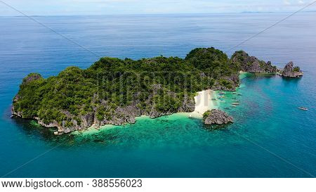 Travel Concept: Tropical Sand Beach And Turquoise Water View From The Top. Lahos Island, Caramoan Is