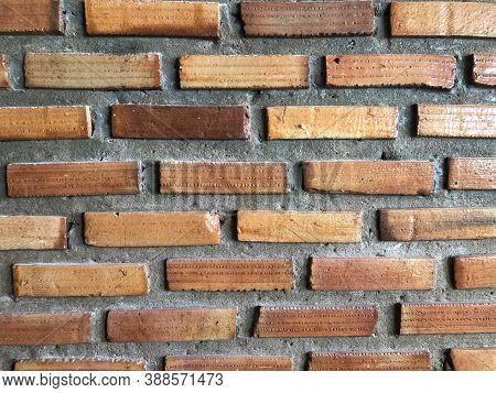 Abstract, Imperfectly Built Brick Wall With Rough Plaster.