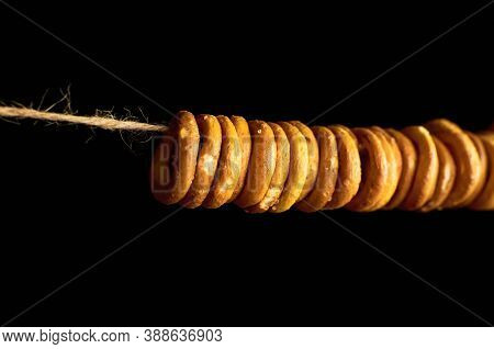 Bagels On A Rope On Dark Background.