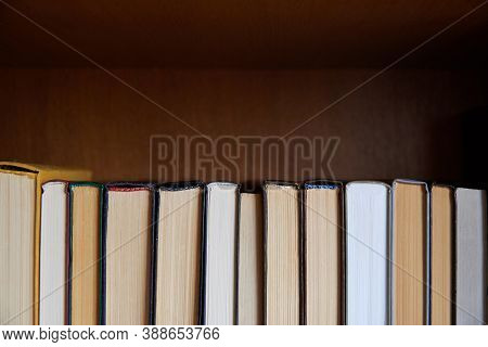 Book Spines Lined Up, Close-up, Learning And Education Concept.