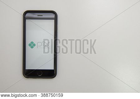 Florianopolis, Brazil. 10/07/2020: Pix Logo On The Smartphone Screen Next To Dollar Sign Made By 1 R