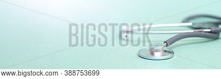 Stethoscope On Blue Background. Banner. Copy Space. Place For Text