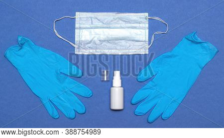 Face Mask With Hand Sanitizer Bottle, And Latex Gloves. Coronavirus Prevention Medical Surgical Mask