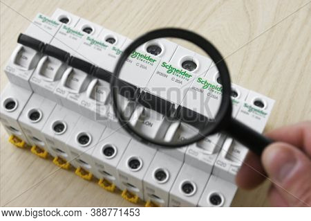 Kharkov, Ukraine - September 22, 2020 : Schneider Electric Circuit Breakers On Light Wood Background