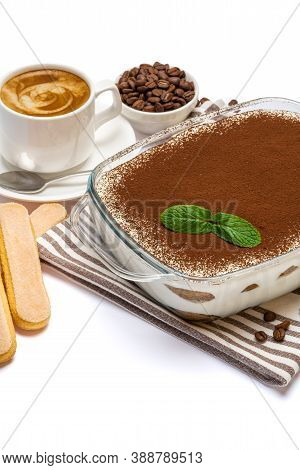 Traditional Italian Tiramisu Dessert In Glass Baking Dish, Savoiardi Cookies And Cup Of Fresh Espres