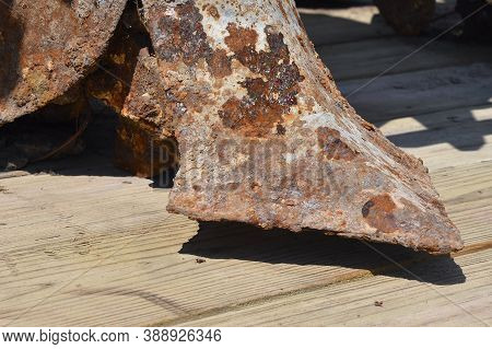 An Extremely Rusty And Corroded Plow Share Of An Old Trip Plow.