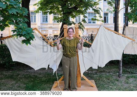 Mechanical Wings Of The Italian Inventor Leonardo Da Vinci. The Woman With The Mechanism Of Retro Wi