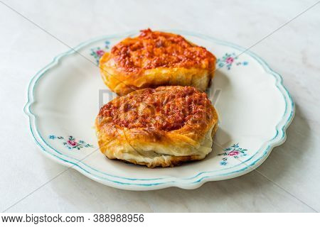 Turkish Traditional Food Borek Manti With Minced Meat, Tomato Paste And Yogurt / Yoghurt Burek Dumpl