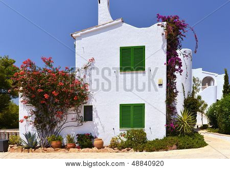 Typical House With Flower Pots In Mallorca, Spain