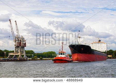 Tugboat Towing A Ship