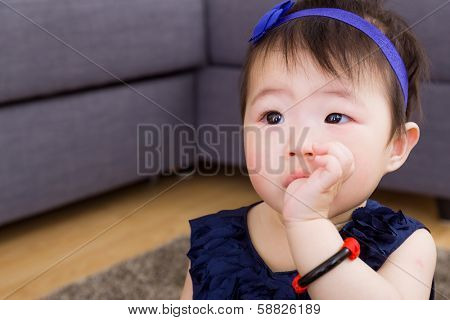 Baby sucking finger in mouth
