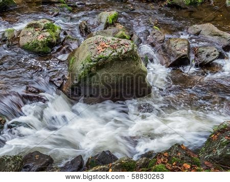 a creek with rocks and running water. landscape experience in nature.