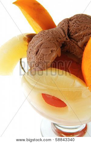 fresh raw  tropical fruits with chocolate ice cream in big glass isolated on white background