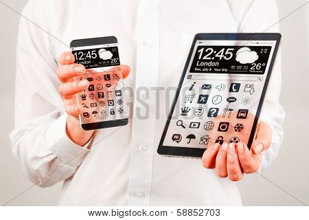 Smartphone (phablet) and tablet with a transparent display in human hands. Concept actual future innovative ideas and best technologies humanity.