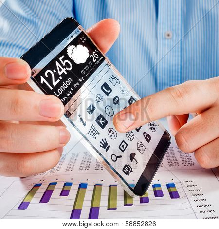 Smartphone (phablet) with a transparent display in human hands. Concept actual future innovative ideas and best technologies humanity.