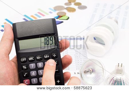 Light Bulb, Calculator And Euro Coins