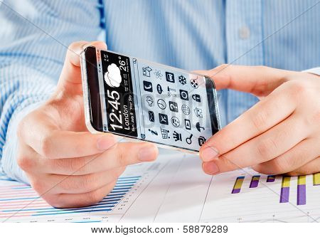 Smartphone (phablet) with a transparent display in human hands. Concept actual future innovative ideas and best technologies humanity.