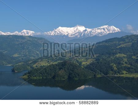 Snow capped Annapurna Range and lake Begnas Tal