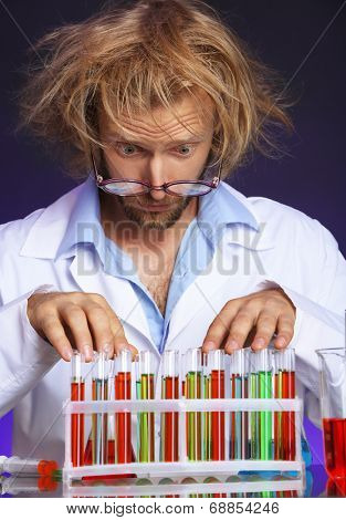 Crazy scientist working in laboratory