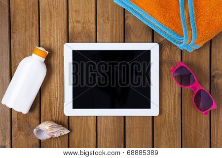 Tablet Pc On The Deck With Summer Concept