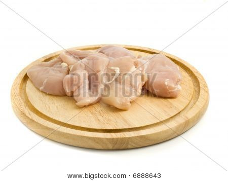เนื้อไก่ดิบบน Hardboard