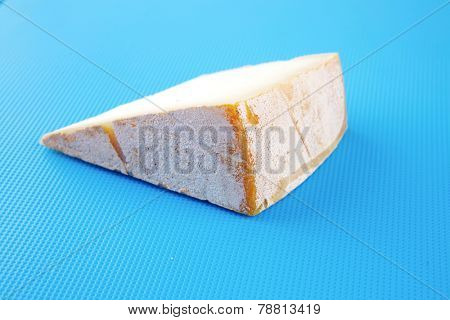 light gauda on blue plastic board