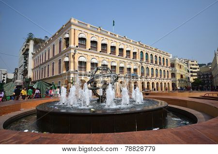 Tourists Visit Historical Buildings Surround The Leal Senado Squarein Macau
