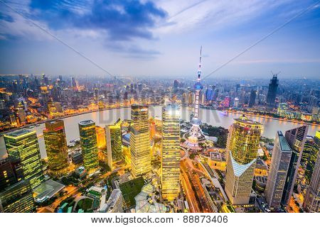 Shanghai, China city skyline over the Pudong Financial District.