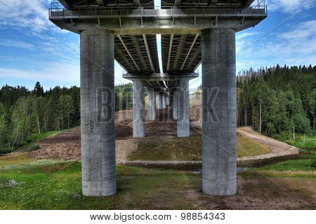 Unfinished Steel Road Bridge On Concrete Pillars, Crosses Bed Stream.