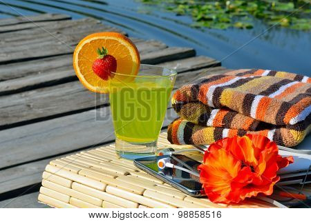 Cocktai With Fruits, Laptop, Cell Phone, Headphones And Bath Towels