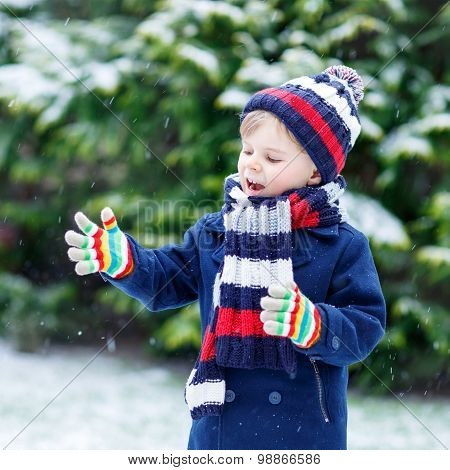 Little Boy Playing With Snow In Winter, Outdoors.