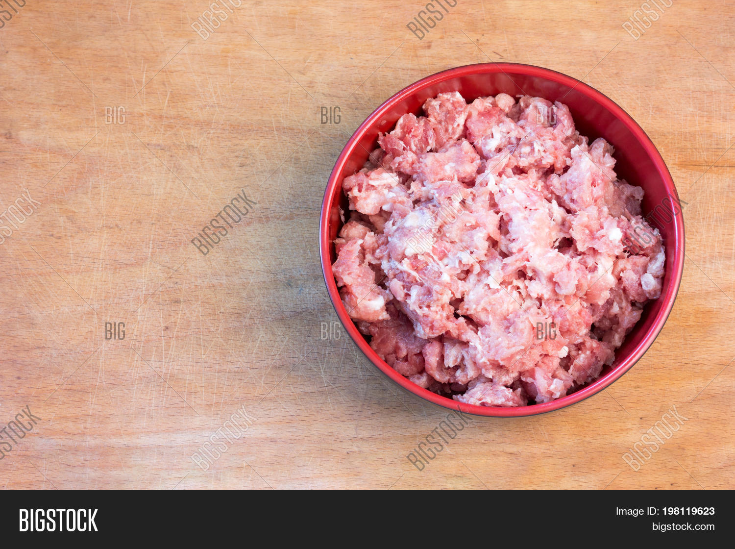 fresh raw minced meat on a cutting board top view close-up
