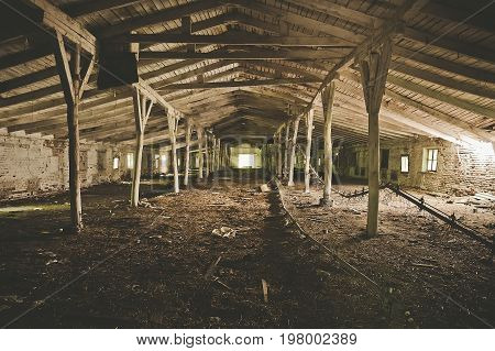 Abandoned warehouse building or barn for livestock factory, toned