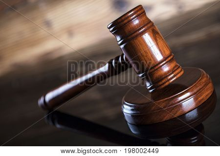Auction and business concept.  Gavel on the wooden background.