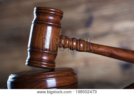Auction and business concept.  Gavel on the wooden background.