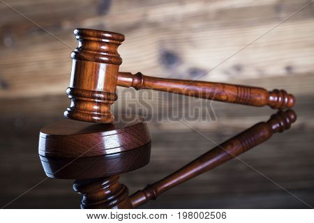 Gavel. Auction and business concept. Wooden background.