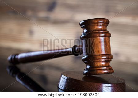 Gavel. Auction and business concept. Wooden background.