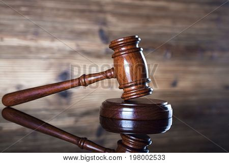 Gavel. Auction and business concept. Wooden background.