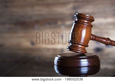 Gavel. Auction and business concept. Wooden background.