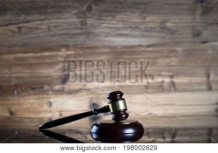 Gavel. Auction and business concept. Wooden background.