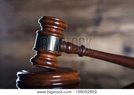 Gavel. Auction and business concept. Wooden background.