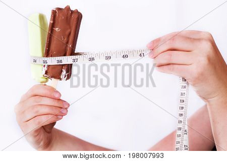 Woman Hands Putting Measuring Tape Around Ice Cream Bar, Close-u