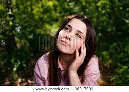 Portrait Of Dreamy Young Woman With Hand Over Face