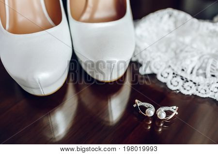 Elegant Bridal Shoes And Silver Earrings With Pearl
